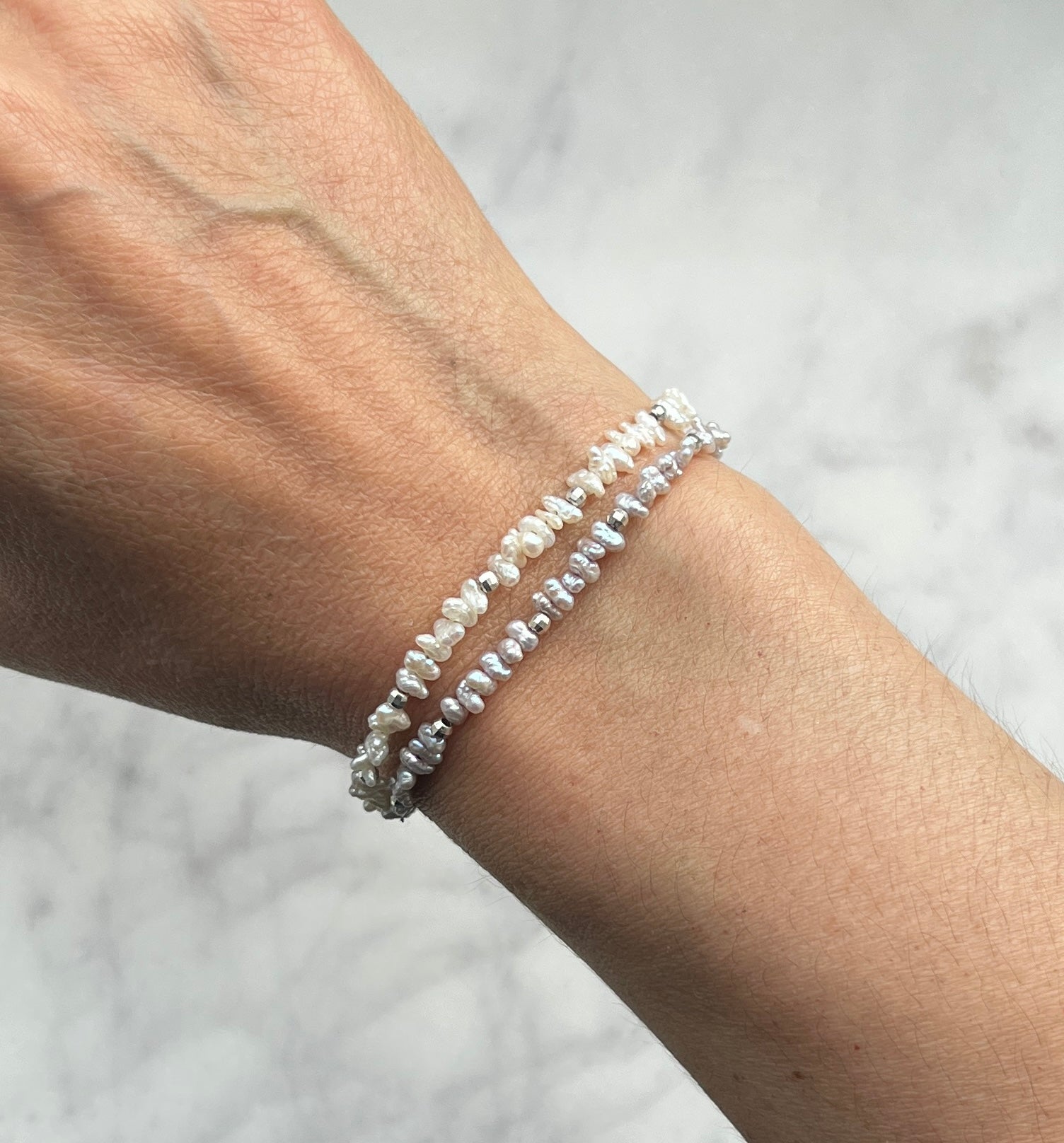 Sterling silver and mauve freshwater pearl bracelet.