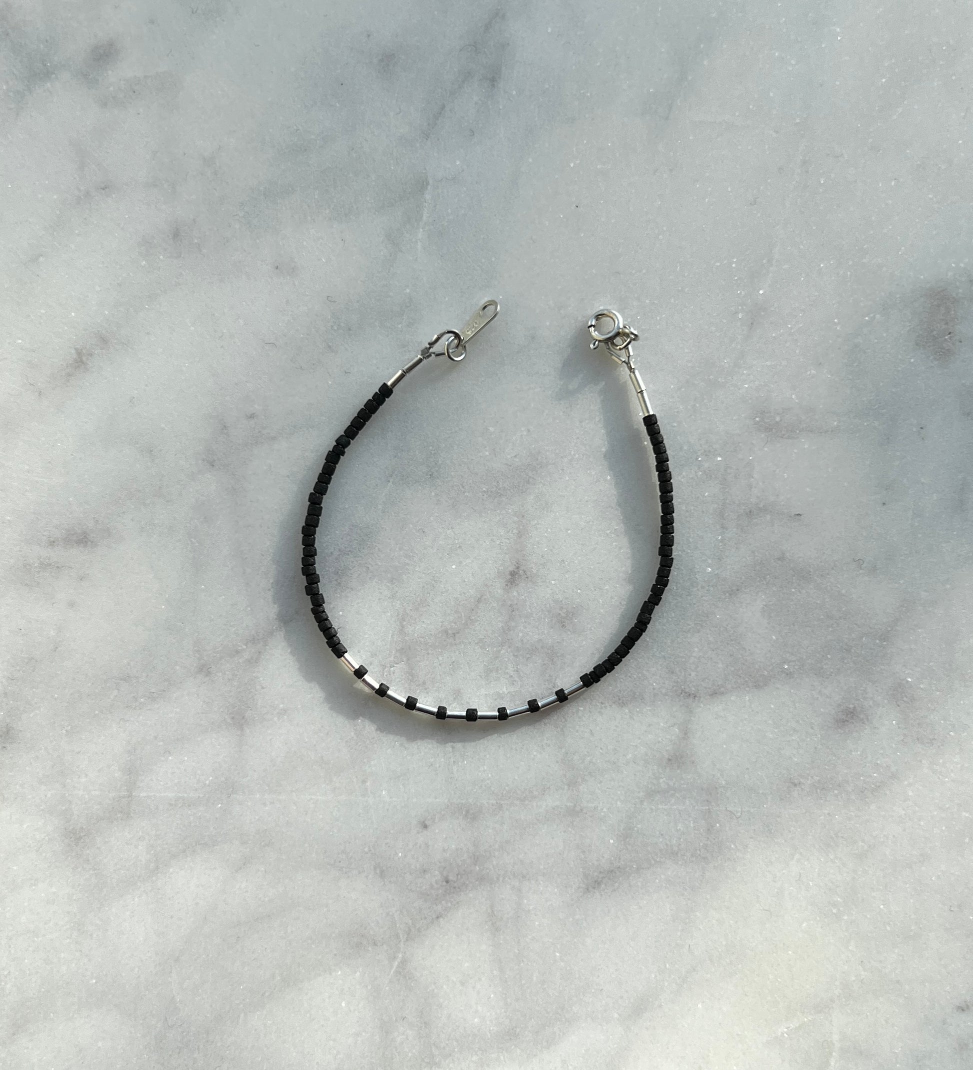 Sterling silver with black Afghan beads