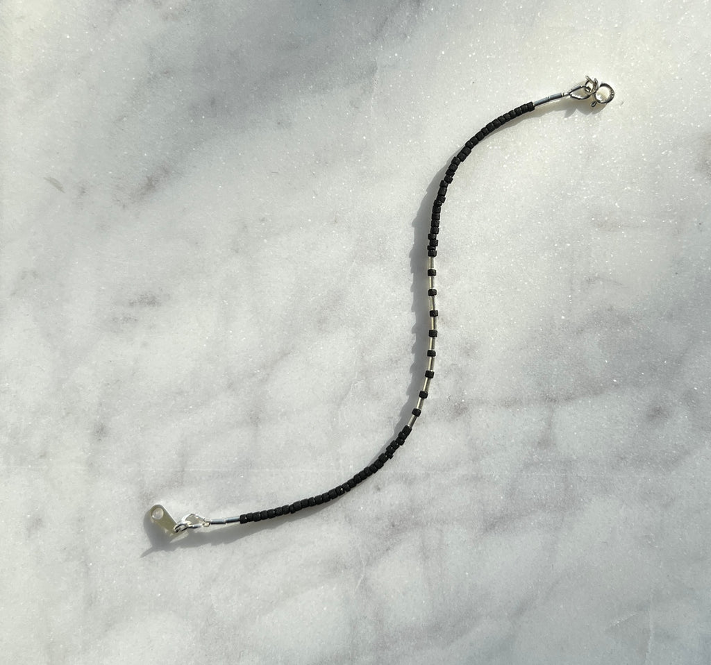 Sterling silver with black Afghan beads