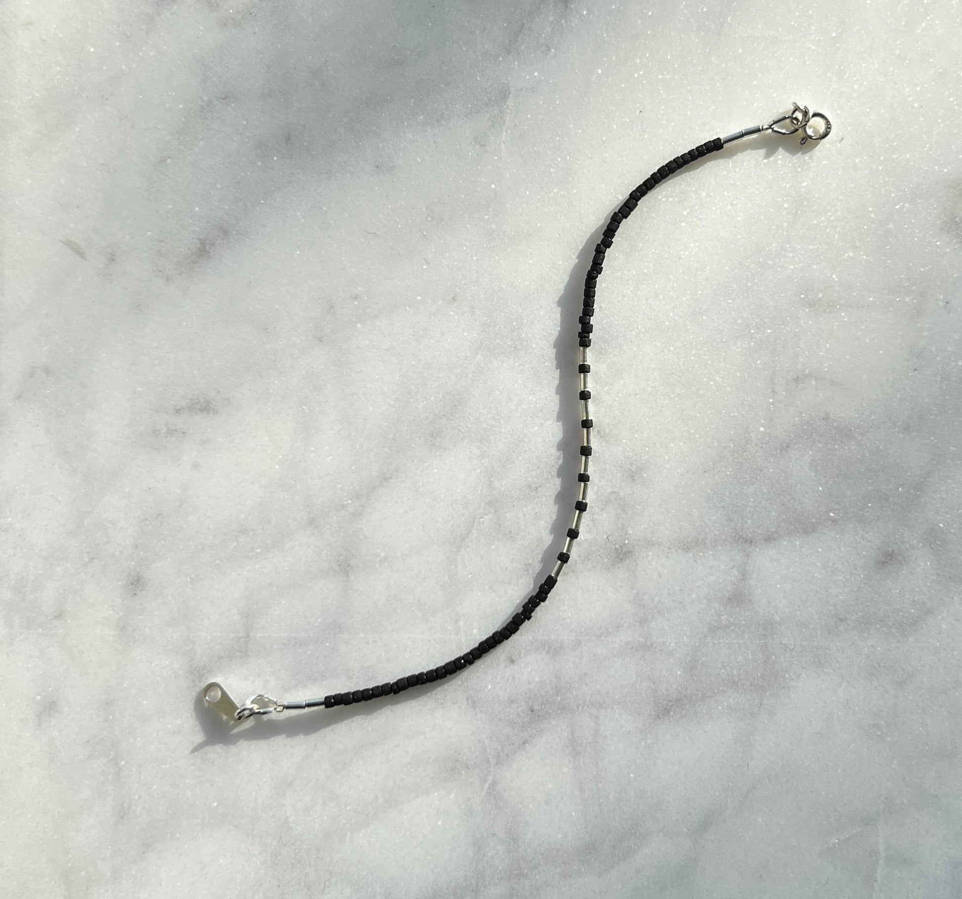 Sterling silver with black Afghan beads