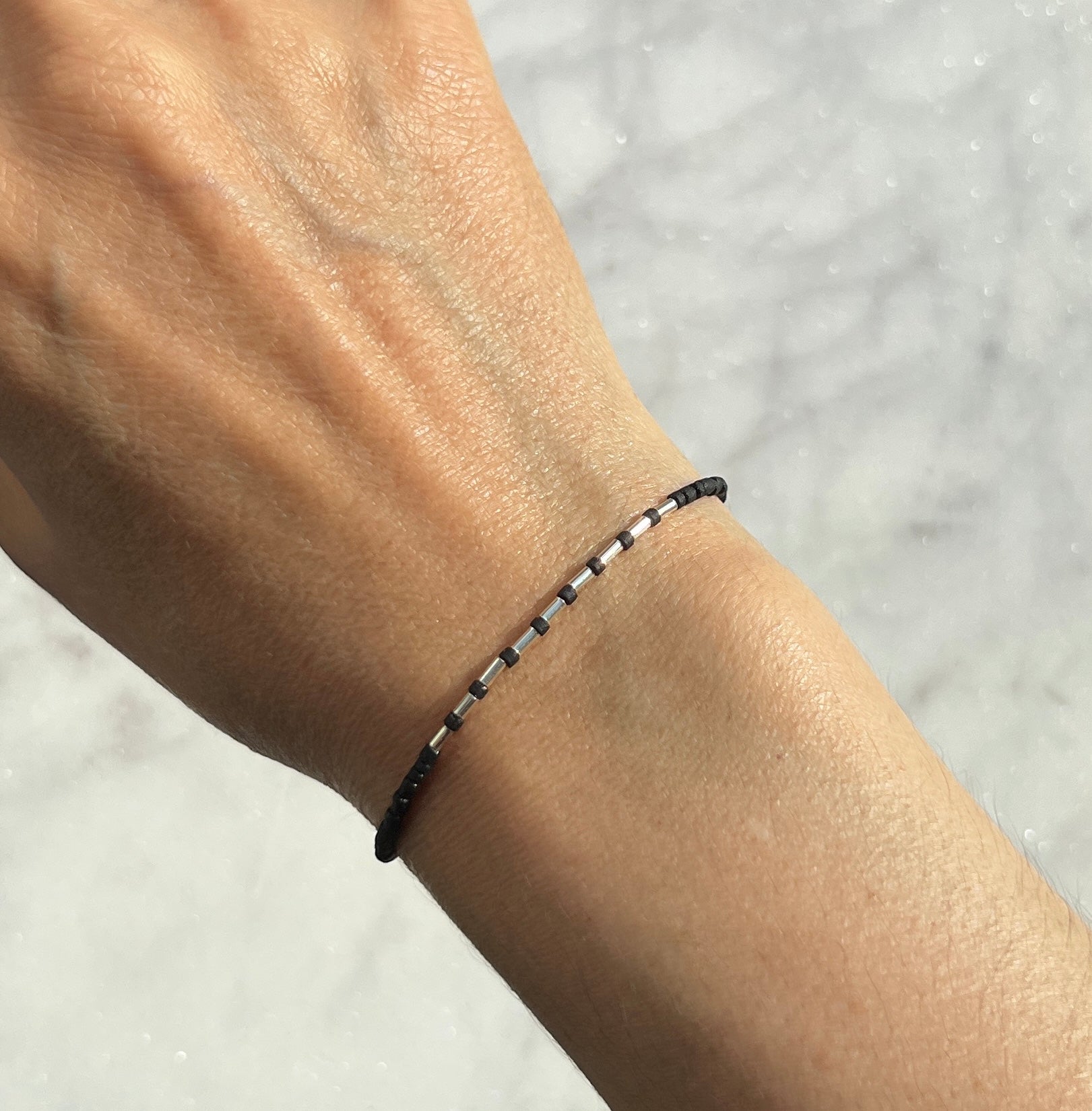 Sterling silver with black Afghan beads