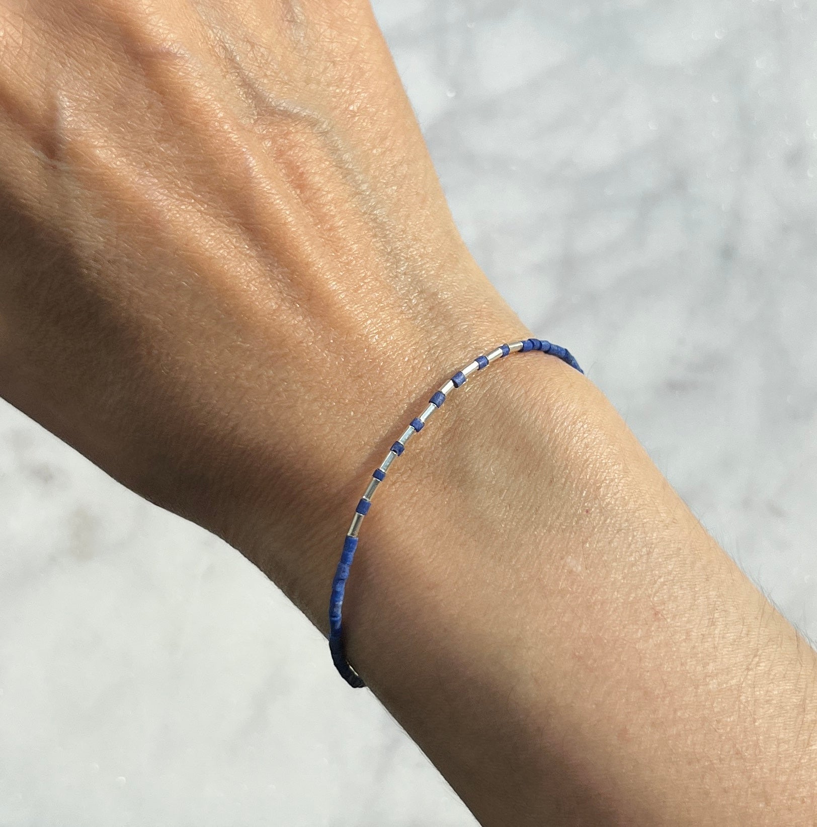 Sterling silver with blue Afghan beads