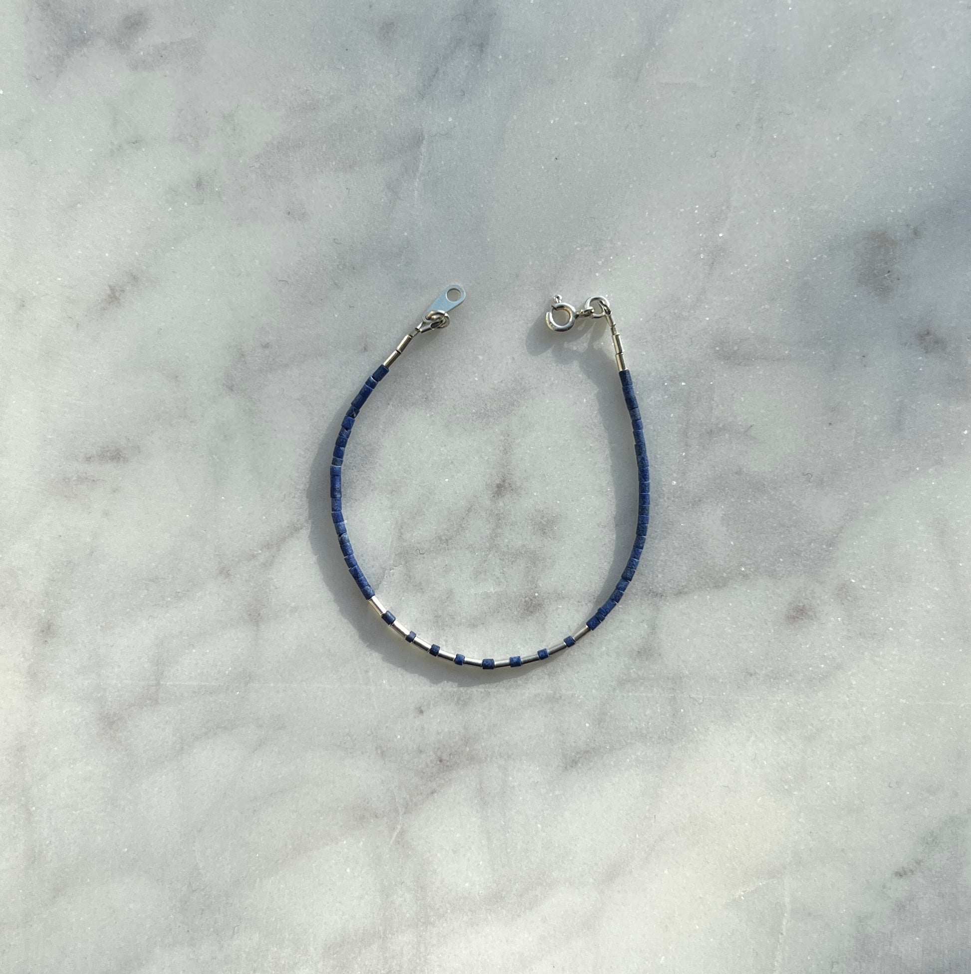 Sterling silver with blue Afghan beads