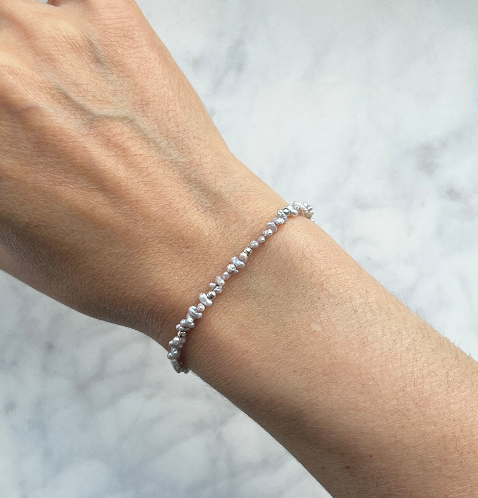 Sterling silver and mauve freshwater pearl bracelet.