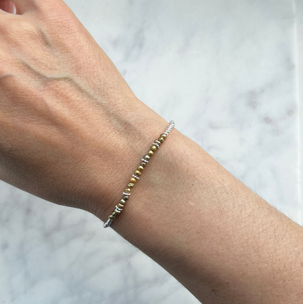 Sterling silver and olive green freshwater pearl bracelet.