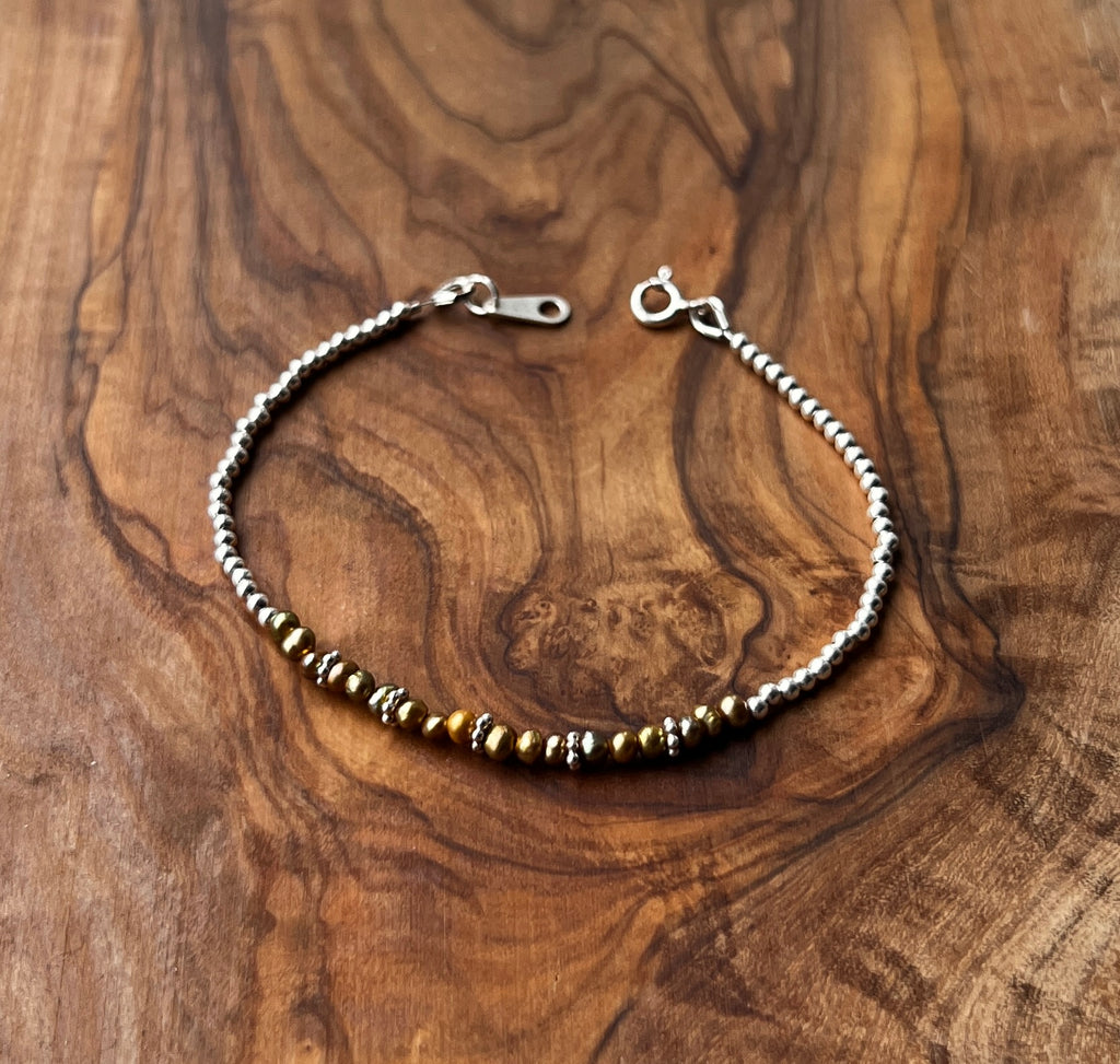 Sterling silver and olive green freshwater pearl bracelet.