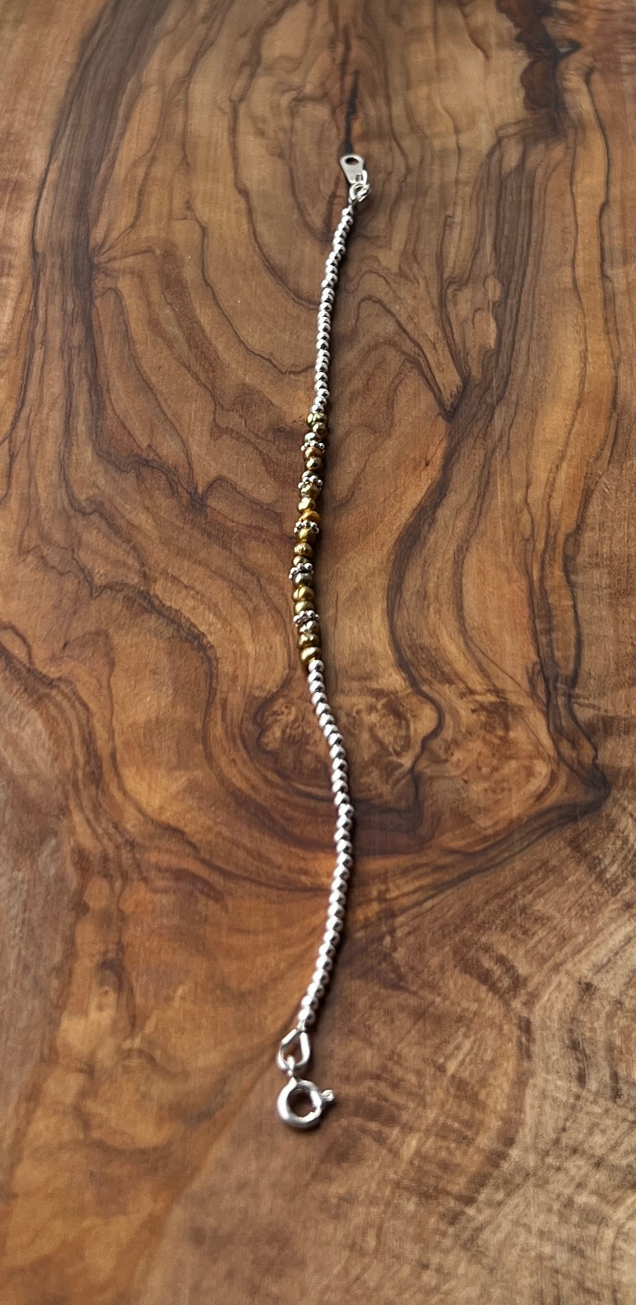 Sterling silver and olive green freshwater pearl bracelet.