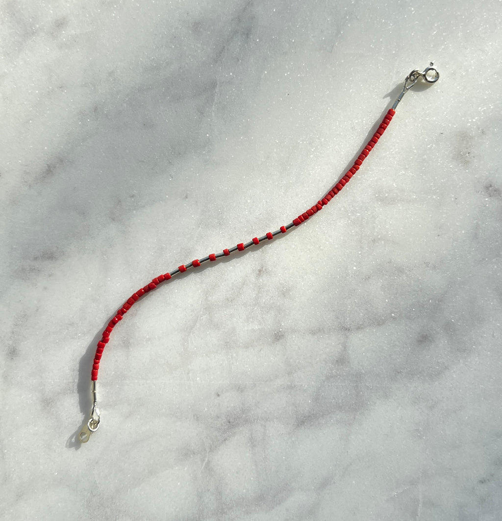 Sterling silver with red Afghan beads