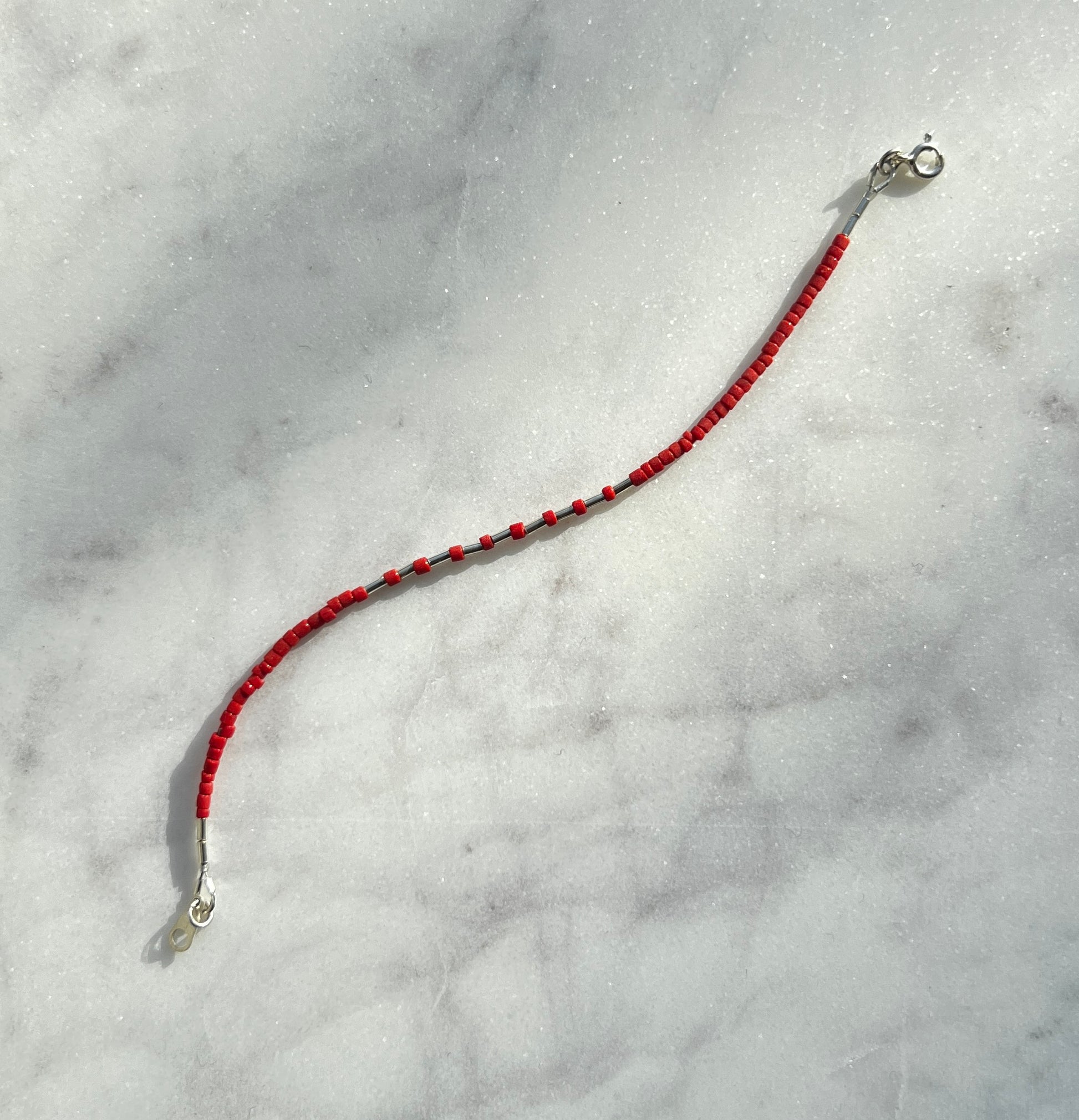 Sterling silver with red Afghan beads