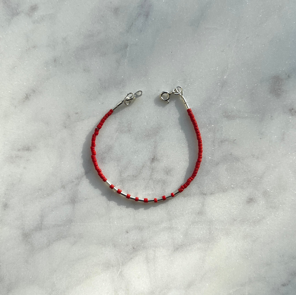Sterling silver with red Afghan beads