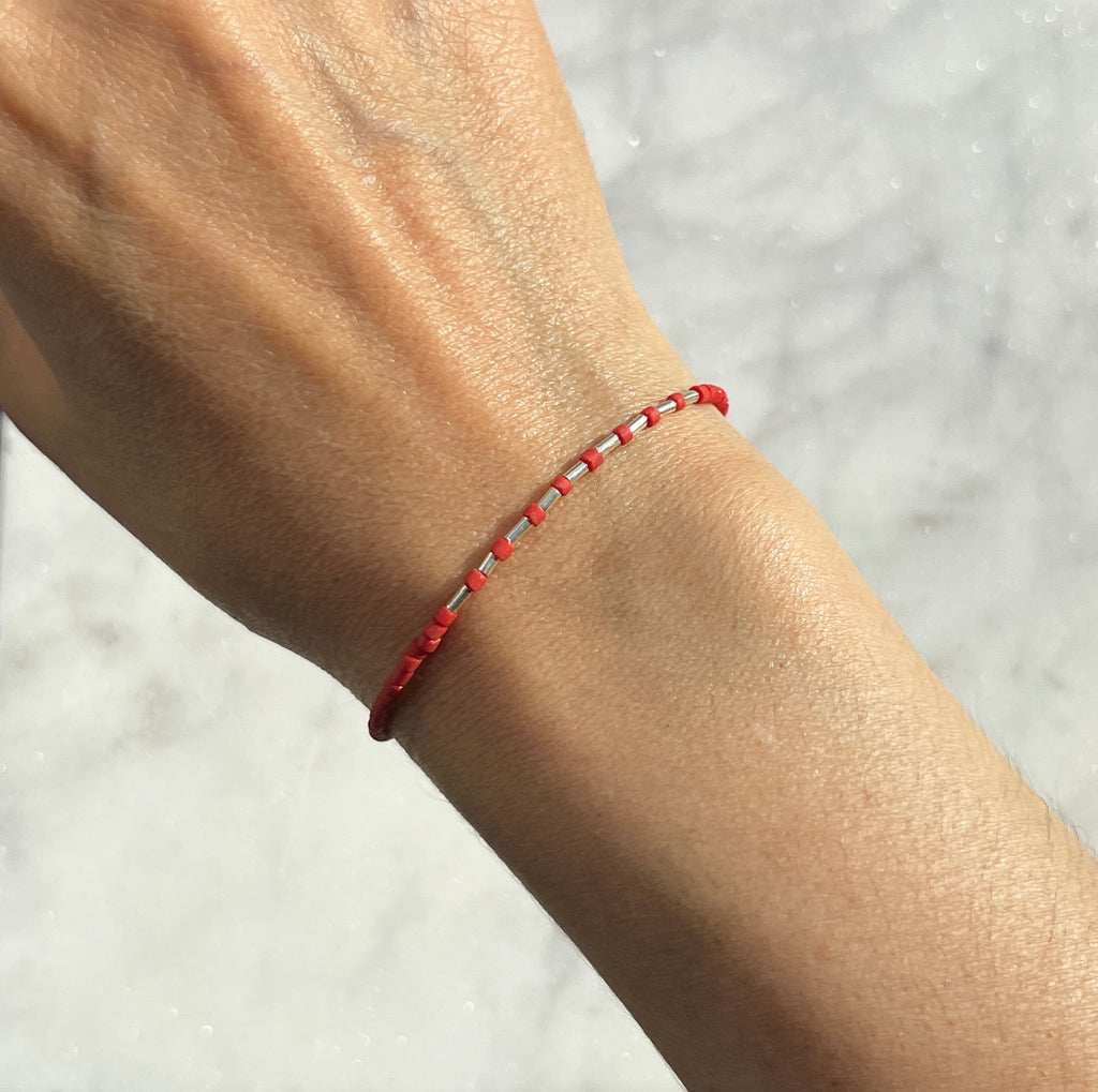 Sterling silver with red Afghan beads