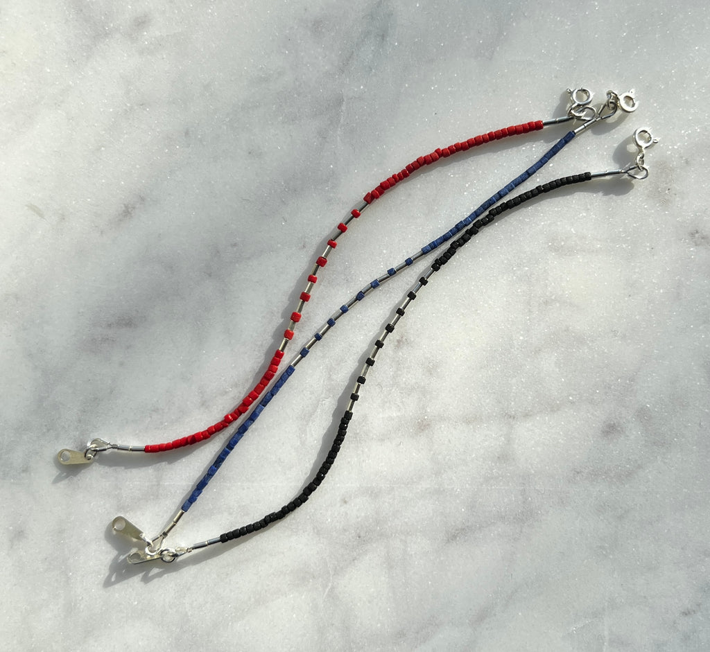 Sterling silver with black Afghan beads