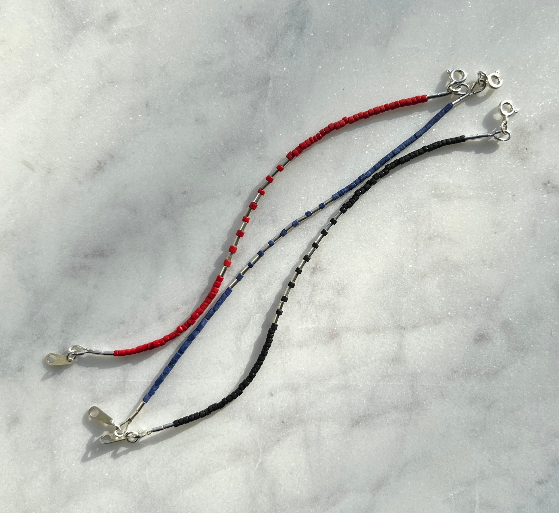 Sterling silver with black Afghan beads