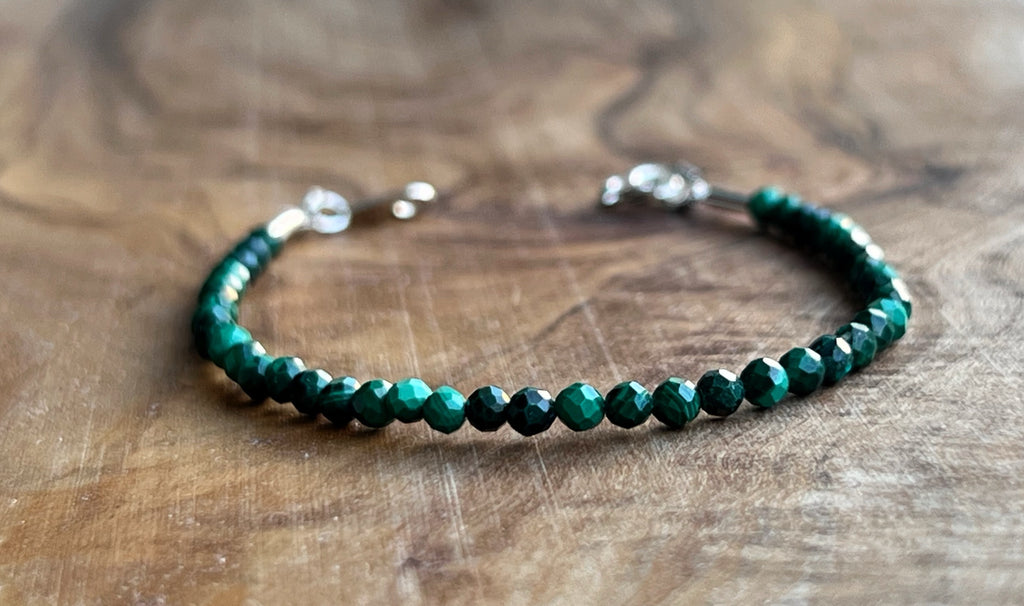 Green malachite faceted gemstone with sterling silver bracelet