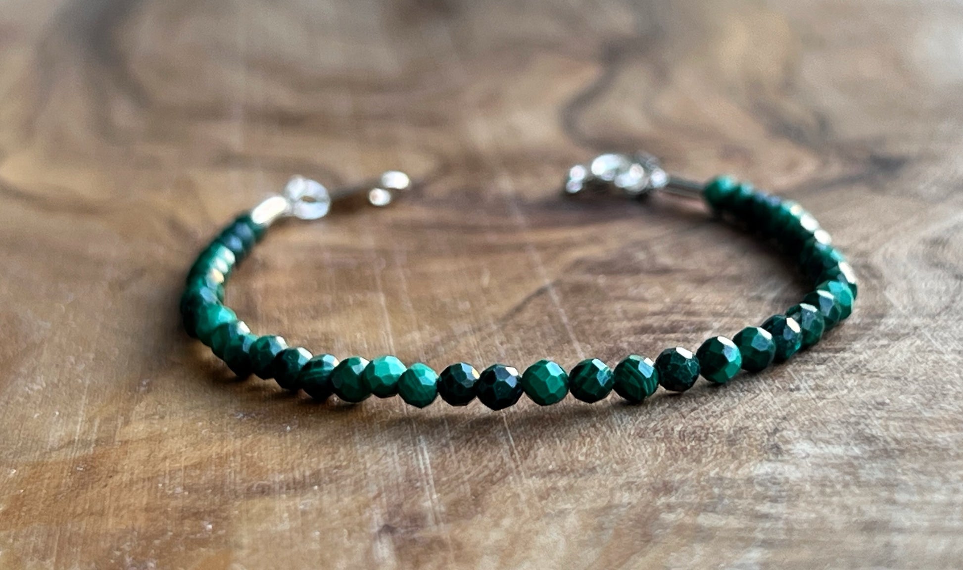 Green malachite faceted gemstone with sterling silver bracelet