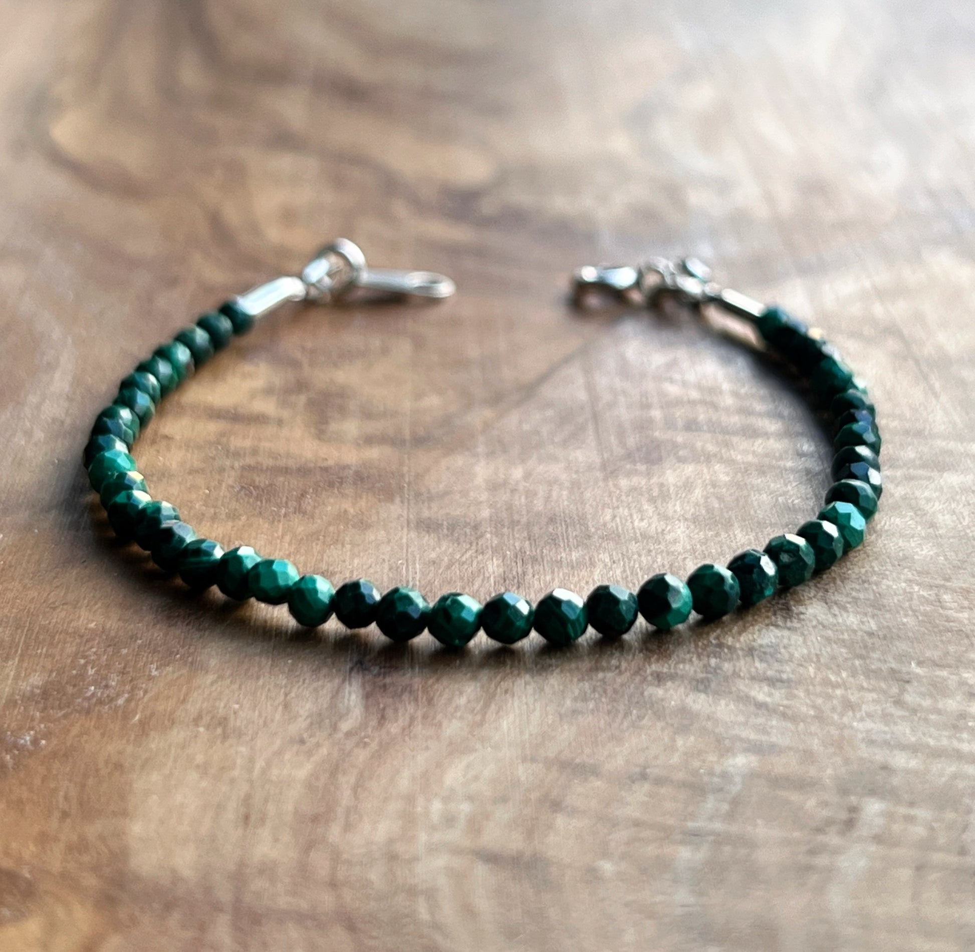 Green malachite faceted gemstone with sterling silver bracelet