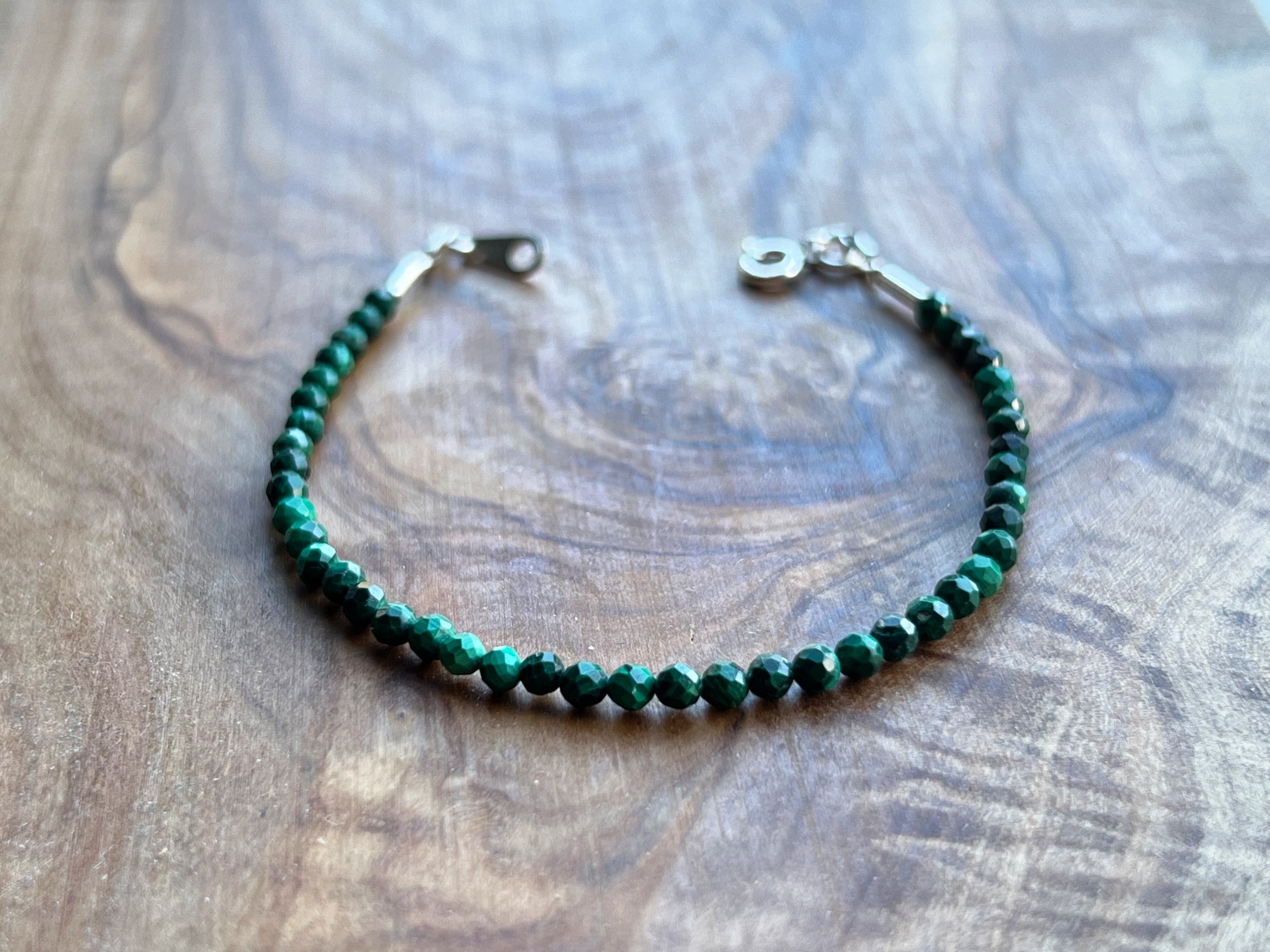 Green malachite faceted gemstone with sterling silver bracelet