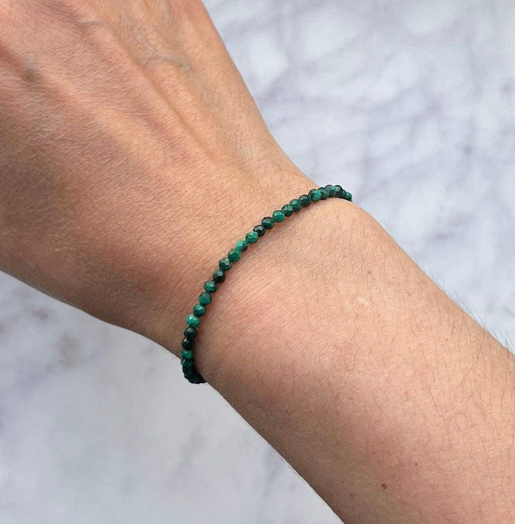 Green malachite faceted gemstone with sterling silver bracelet