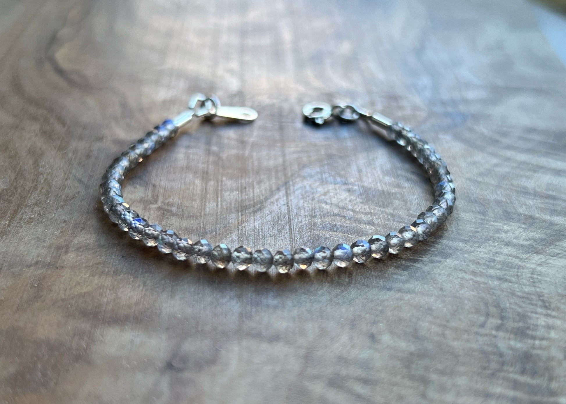 Iridescent labradorite micro faceted gemstone with sterling silver bracelet