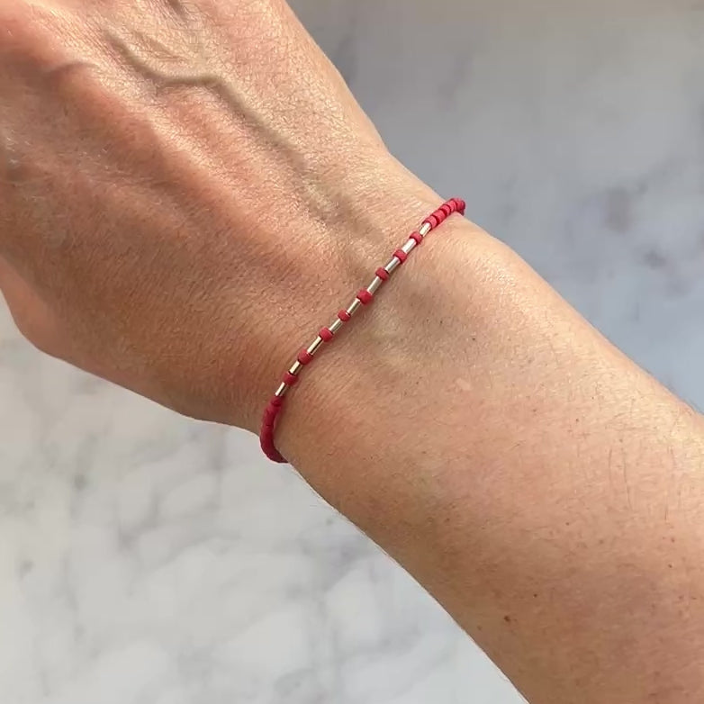 Sterling silver with red Afghan beads