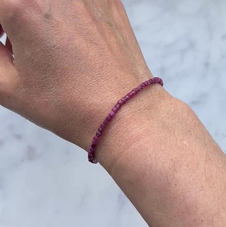 Pinkish red ruby gemstone with sterling silver bracelet