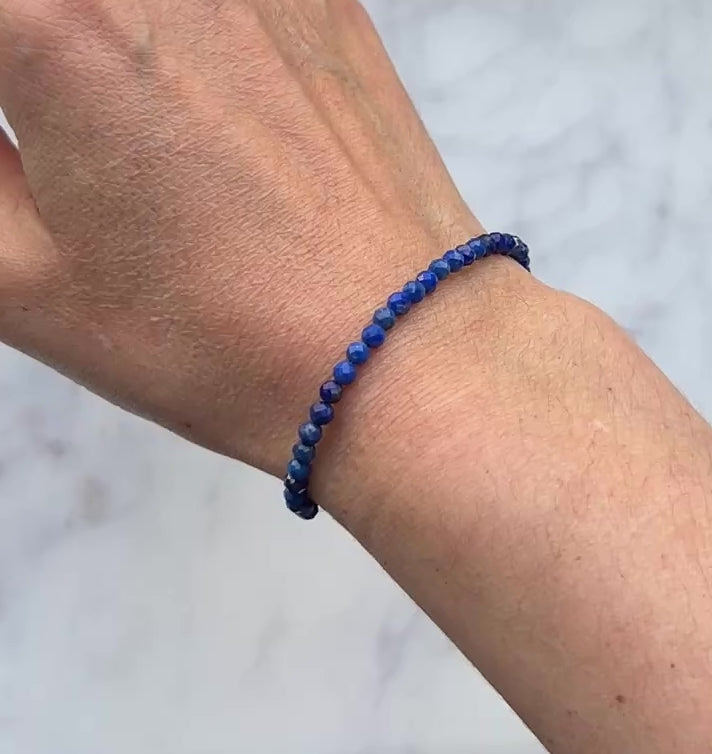 Blue lapis lazuli faceted gemstone with sterling silver bracelet